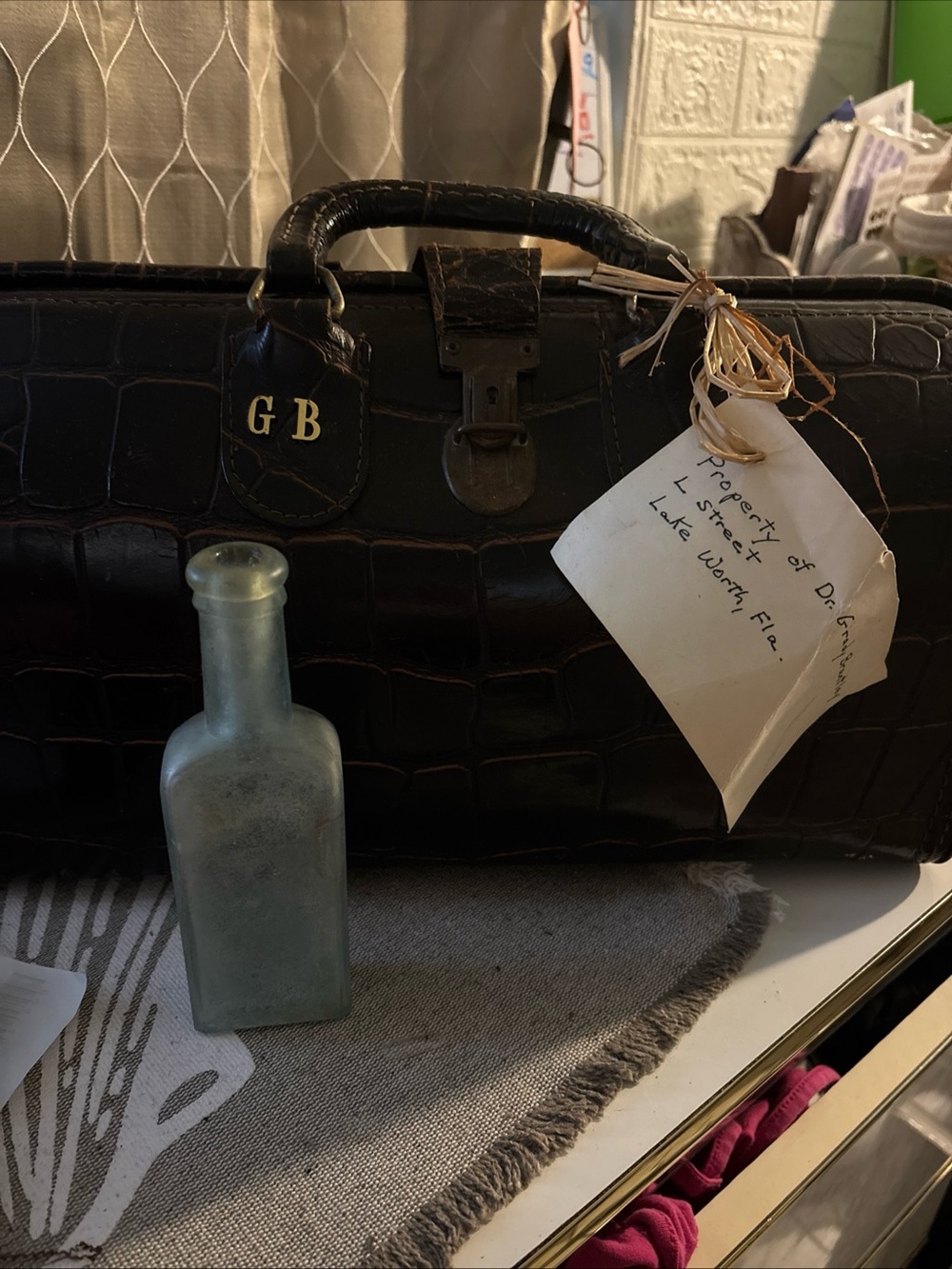 Collectible memorabilia, physician bag, and Perry Davis painkiller bottle